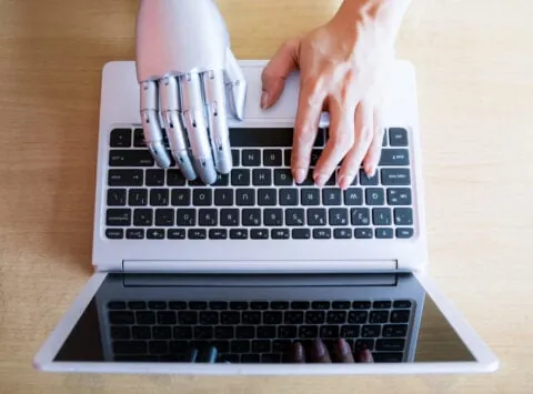 Robot hands and fingers point laptop button advisor chatbot robotic artificial intelligence concept