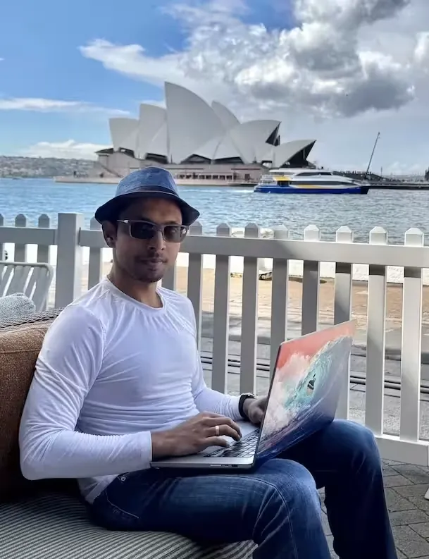 Dileep Working on His Macbook Pro infront of the Sydney Opera House
