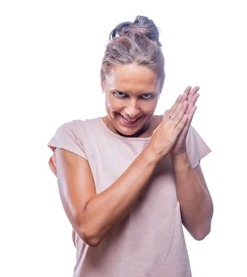 Woman smiling with malicious laugh looking insan