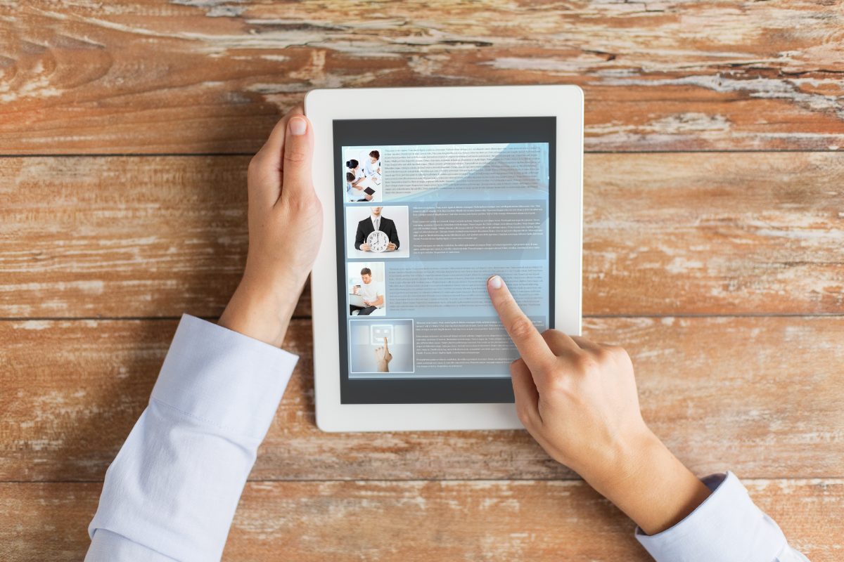 18947108 close up of male hands showing blog on tablet pc