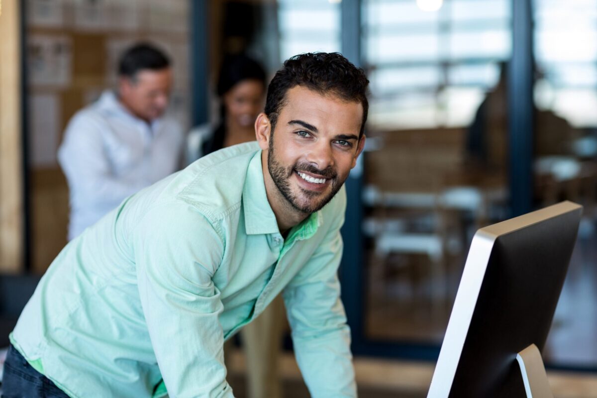 29195344 young man working on computer scaled