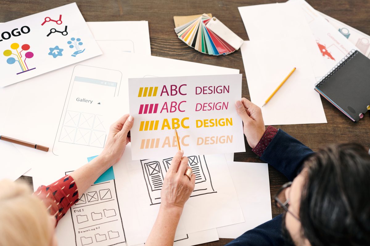 Typography in Web Design: How It Affects User Experience and Trust 1 hands of mature female designer pointing at paper 2025 04 02 22 27 15 utc